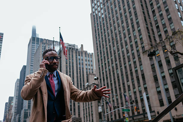 istock Man having a phone conversation in NYC 2231540925