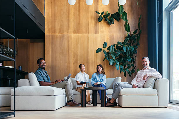 istock Friendly Team Meeting in a Modern Workspace With Wooden and Greenery Decor 2231544699