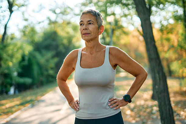 istock Senior woman resting after exercising in a park 2231546772