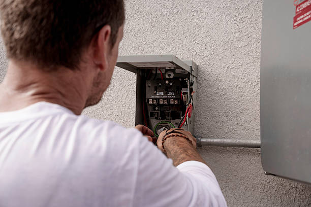 istock Male technician wires solar panel circuit breaker on residential wall 2231548458