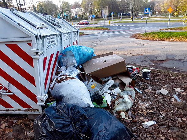 istock The Overflowing Waste Bin Presents a Concern in the Urban Environment for Local Communities 2231551395