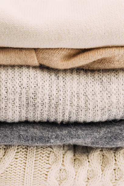 istock A neatly stacked pile of cozy knit sweaters 2231553300