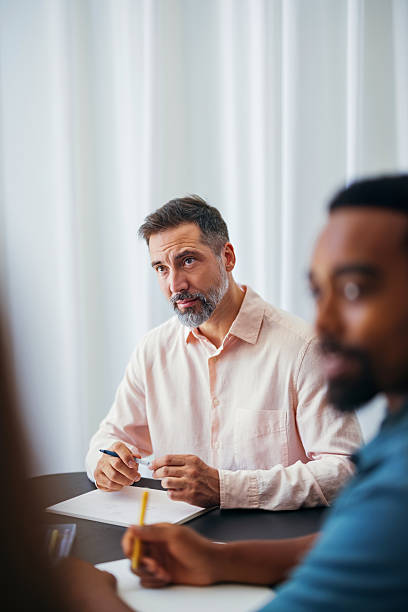istock Professional Team in Discussion During a Collaborative Business Meeting in Modern Workspace 2231553839