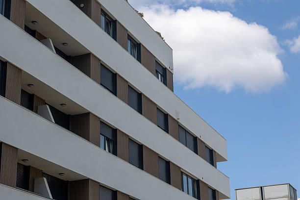 istock Modern apartment building with balconies and shutters reaching for the sky 2231555192