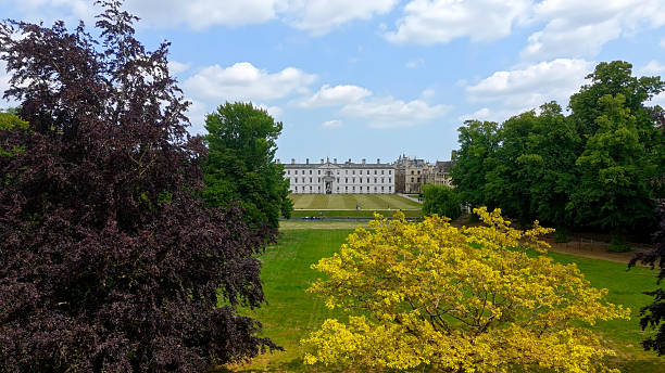 istock Downing College framed by trees in Cambridge University, UK 2231560594