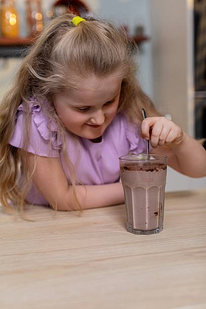 Relishing a delicious Chocolate Milkshake A truly delightful Moment for enjoyment and fun
