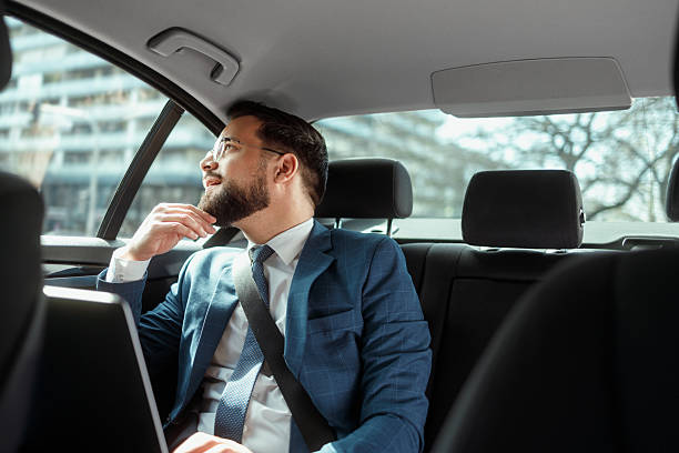istock Businessman Working on Laptop in Car 2231565575