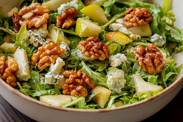 istock healthy fall salad with arugula pear cheese and candied walnuts 2231570488