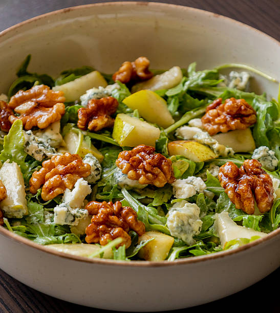 istock healthy fall salad with arugula pear cheese and candied walnuts 2231570495