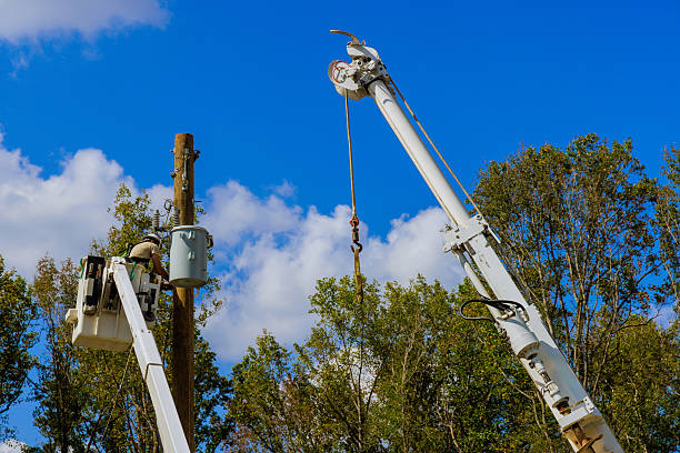 istock Utility workers repairing power lines on work day in residential area 2231571043