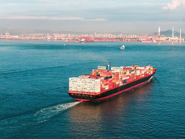 istock The cargo ship is approaching the port with the tugboat 2231573057