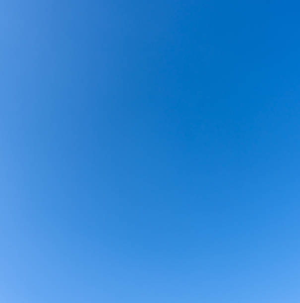 istock Low angle view and full frame of beautiful light blue sky without clouds in the afternoon on sunny day used as natural background texture in decorative art work 2231578085