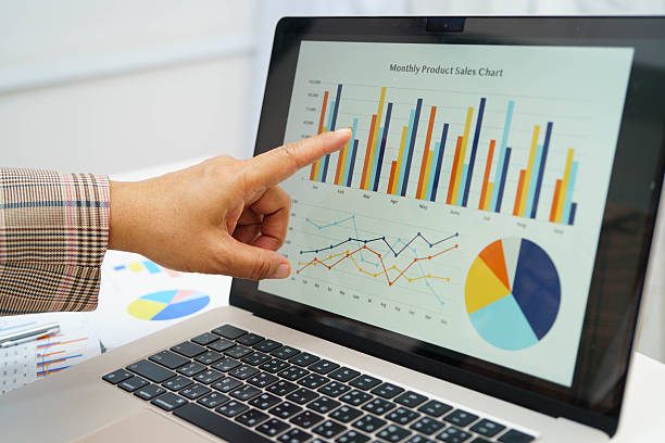 Business woman working and analysis with statistic graph in office.