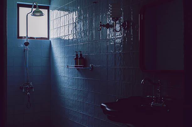 istock Retro Bathroom Interior with Shower and Blue Tiled Wall 2231587740