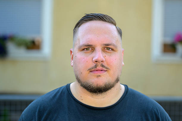 Close-up image of a caucasian guy looking away