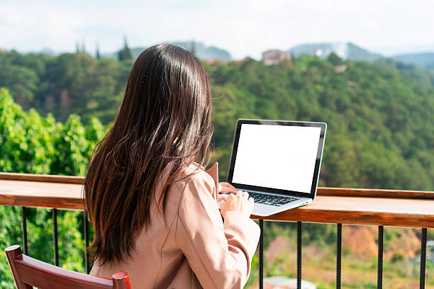 istock Woman freelancer working on laptop. work from anywhere, 5G concept. Blank screen for copy space 2231593353