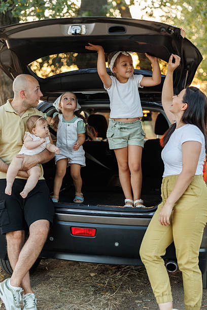 istock Happy family taking a break during road trip through summer nature 2231597639