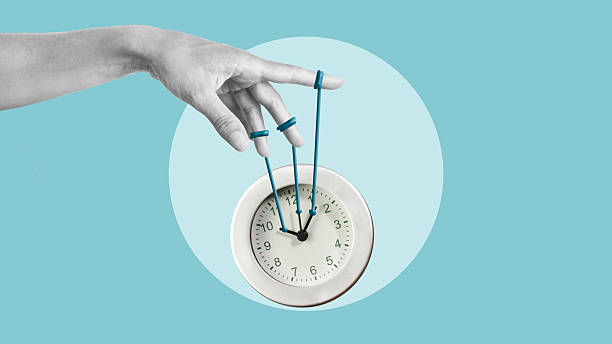 istock Control time, productivity or efficiency as freedom or efficient time management are shown by the hand controlling time with clock puppet 2231598934