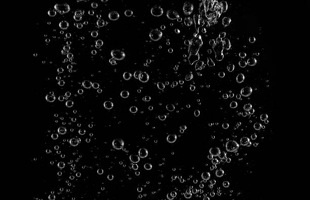 istock Clear water bubbles rising in dark background, abstract underwater texture ideal for design, science, and creative projects. Perfect for backgrounds, overlay, or refreshing clean concept visuals. 2231601312