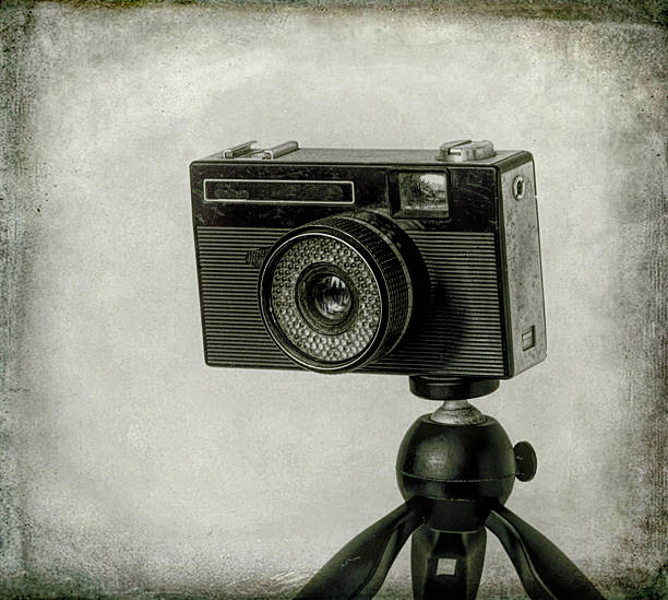 istock old photo camera isolated on white background 2231605485