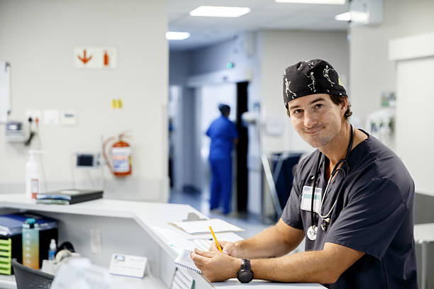 istock Doctor checking documents at Nurse station in a Hospital 2231608320