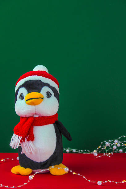 istock Christmas penguin on red green background. 2231608723