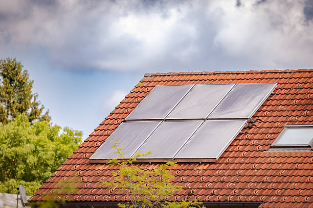 A solar panel is a device that converts sunlight into electricity by using multiple solar modules that consist of photovoltaic cells.\nNeufarn - Germany.