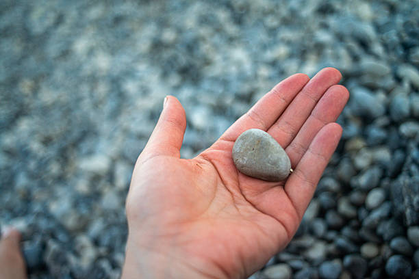 istock Pebble Stones on Coastal Shoreline 2231610197