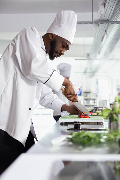 istock Precision and technique shine as chef chopping fresh veggies on a cutting board 2231612338