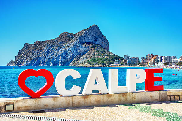 Calpe seafront promenade, a scenic palm-lined walkway along the Mediterranean coast in Spain
