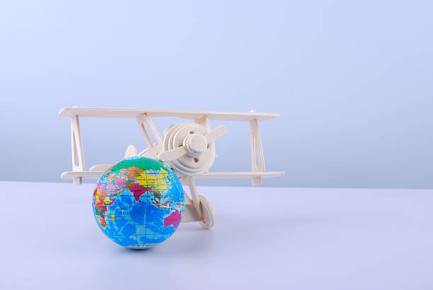 istock Wooden airplane and earth globe 2231616512