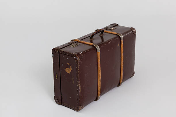 istock A beautifully crafted Vintage Brown Leather Suitcase featuring elegant straps and design 2231616697