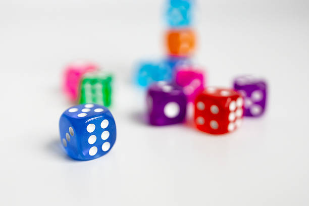 istock Colorful assortment of dice on white background 2231617331