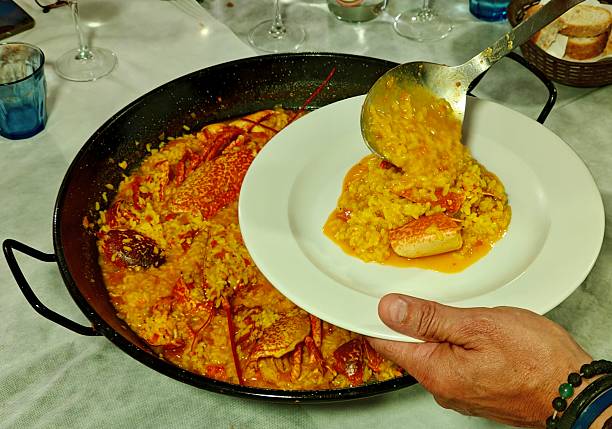 Paella on black and red polka dot