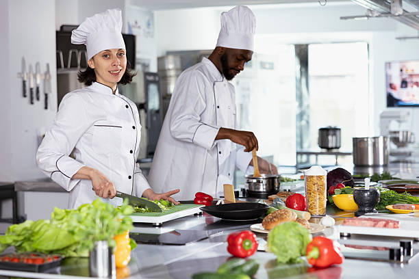 istock Chef preparing gourmet meals by using cutting boards and chopping ingredients 2231619477
