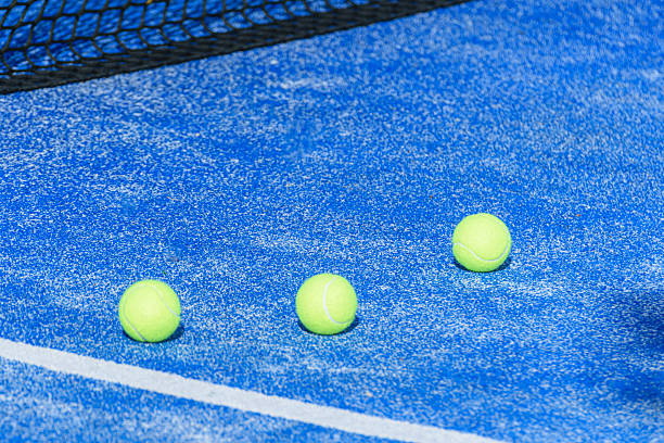 istock Three Padel Balls Court Net Shadow 2231620827