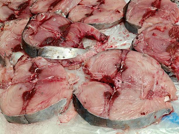 Slices of bonito fish on ice at the supermarket
