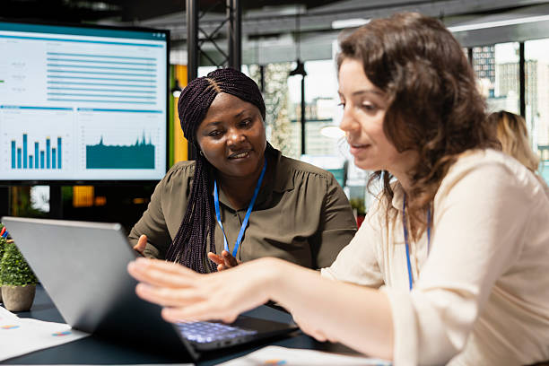 istock Diverse business associates exchanging data files in a briefing meeting 2231624299