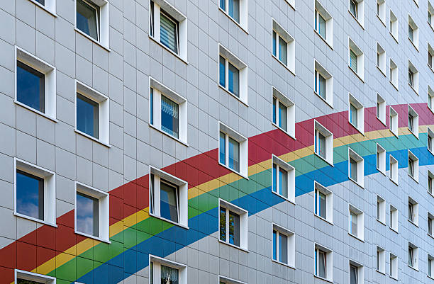 Germany, Berlin, Lichtenberg, August, 22, 2025 - Residential building with a colorful rainbow on the facade