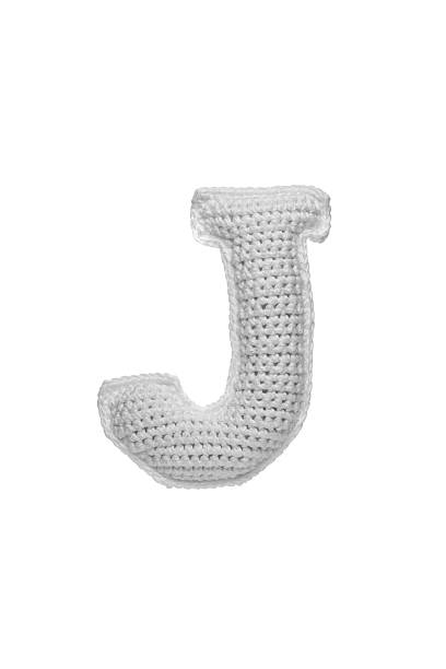 istock Handmade crocheted letter j in light grey yarn, isolated on white background, soft textured decoration or toy 2231626584