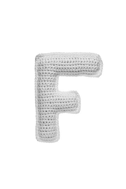 istock Handmade crocheted letter f in light grey yarn, isolated on white background, soft textured decoration or toy 2231626599