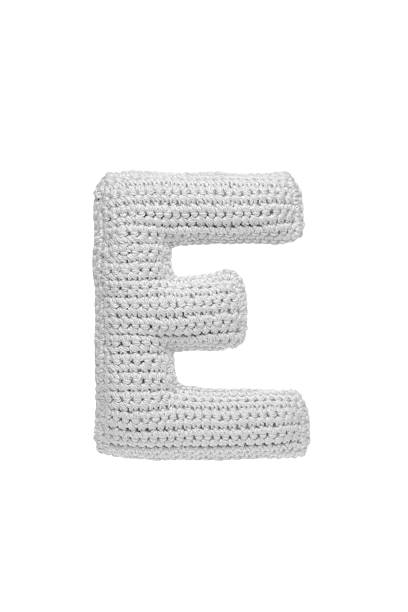 istock Handmade crocheted letter e in light grey yarn, isolated on white background, soft textured decoration or toy 2231626600