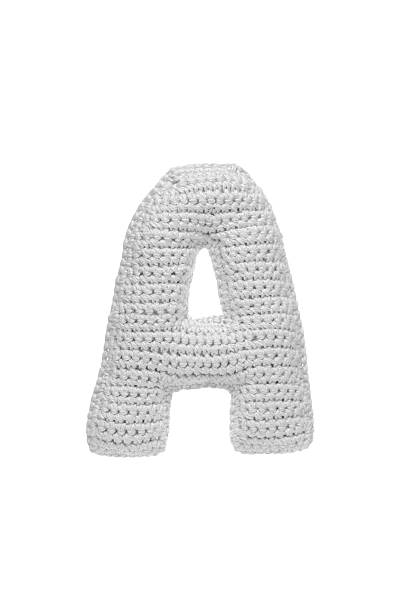 istock Handmade crocheted letter  a in light grey yarn, isolated on white background, soft textured decoration or toy 2231626610