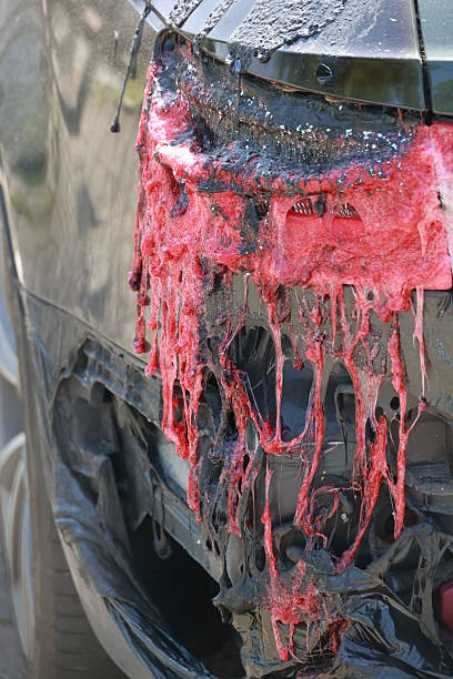 istock A car has been in an accident and has been covered in red paint 2231626656