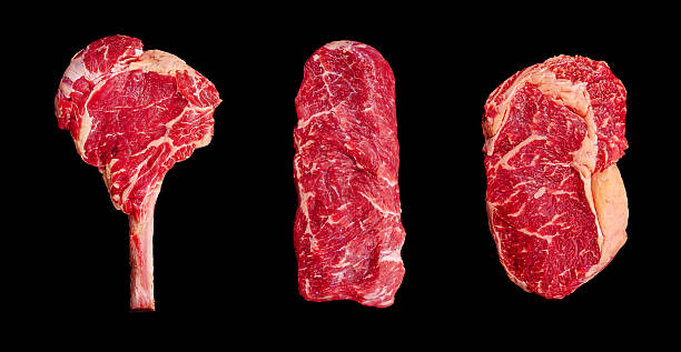 istock Various cuts of fresh red beef on a dark background showcasing meat selection 2231627776