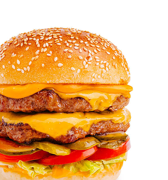 istock Juicy cheeseburger with layers of beef, cheese, and fresh toppings 2231630332