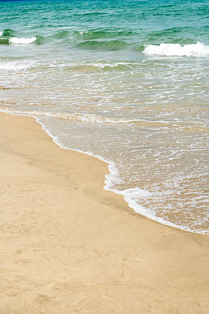 istock Blue Sea Waves Crashing On Sandy Beach 2231630496