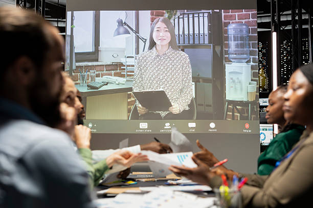 istock Diverse employees attending a video call briefing with the team leader 2231634656
