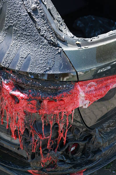 istock A car has been in an accident and has been covered in red paint 2231639993