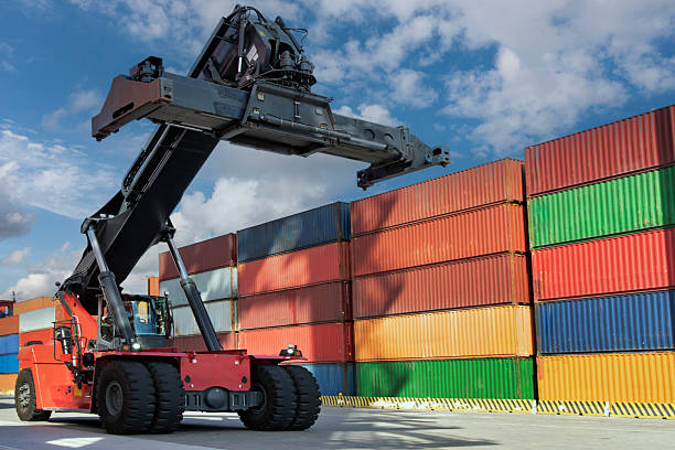 istock Mobile Crane ready for moving the freight container to the yard. 2231640562